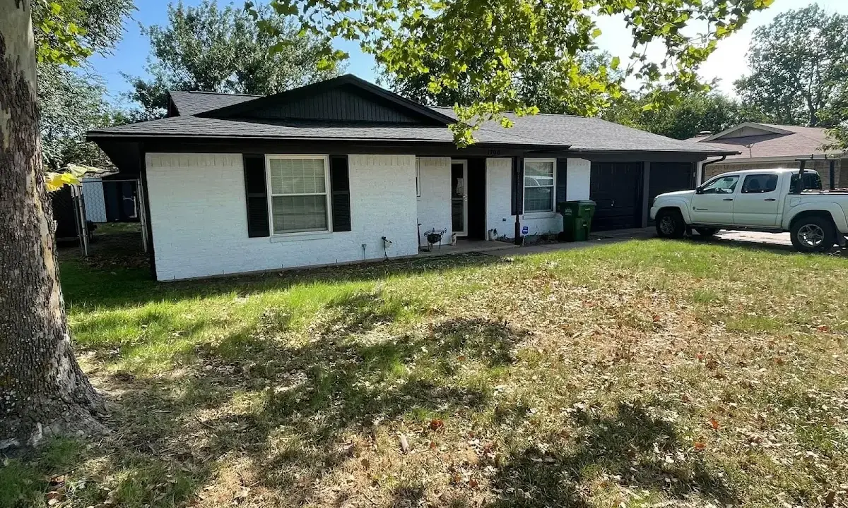 Professional roofing crew working on a residential roof in Clarks Summit